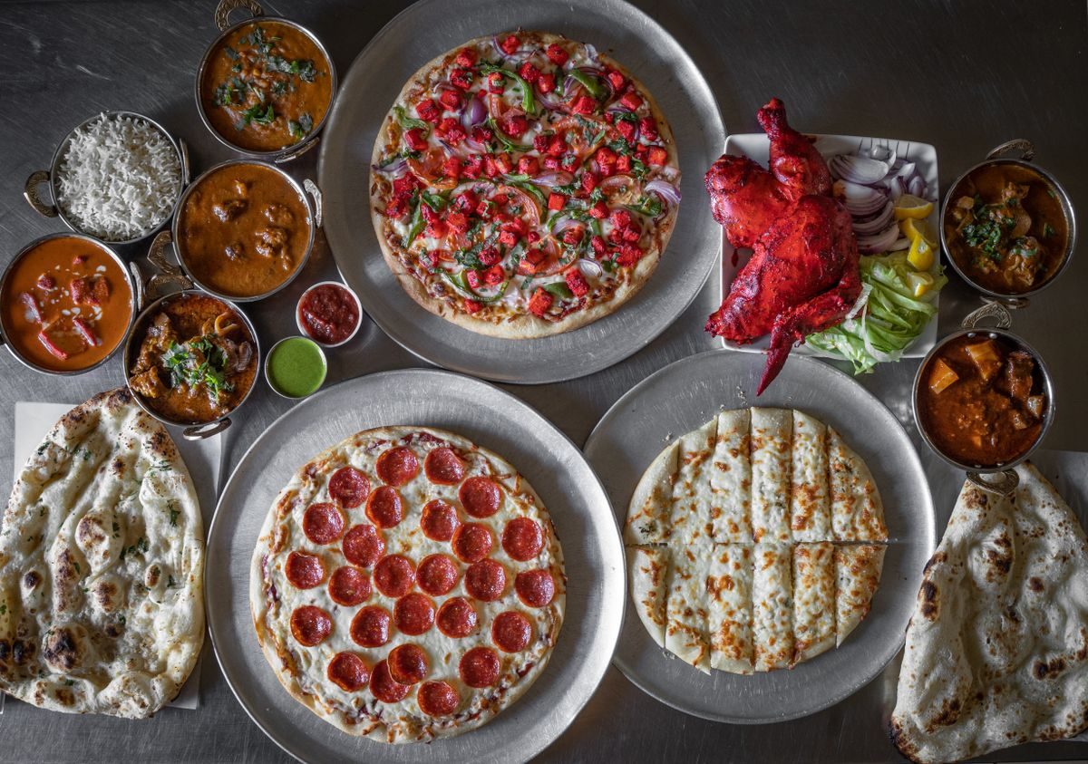 Kombinationsmenu med pizza, tilbehør og sodavand